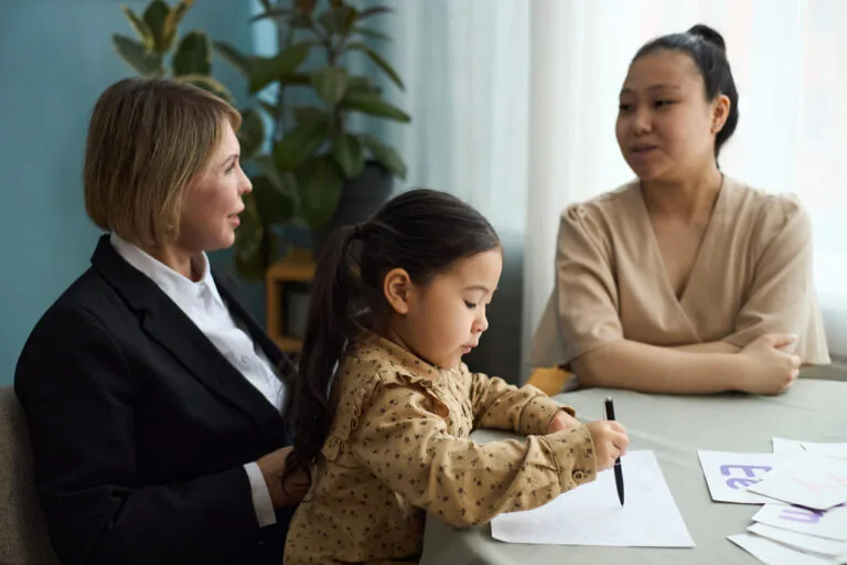 Lawyers in a client meeting around a conference table